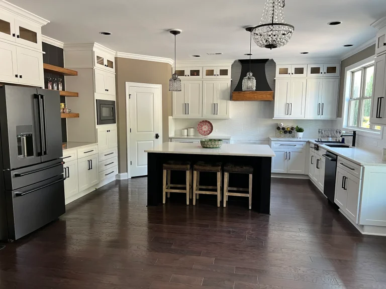 White kitchen remodel with a dark island